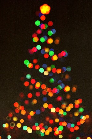 Shinny Christmas Tree, abstract background.Christmas background with shining lights.Merry christmas and happy new year greeting card.Christmas magic treeの写真素材