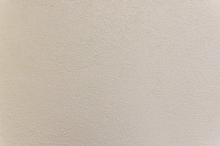Texture of the old plastered beige color cement wall, Surface emboss sharp and rough pattern of...