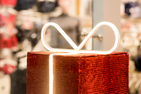 Gift boxe on the background of a lingerie store. Advertising, sales, fashion concept.Beauty, Gift, shopping ,fashion blogger concept. Romantic lingerie for Valentines day temptation. Erotic concept.の写真素材