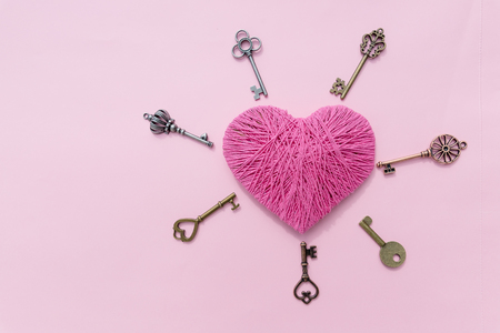 Pink heart with love key. Valentine's Day pink background. Top viewの写真素材