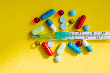 thermometer and colored pills for treating diseases and addiction.thermometer, pharmaceutical drug ,...