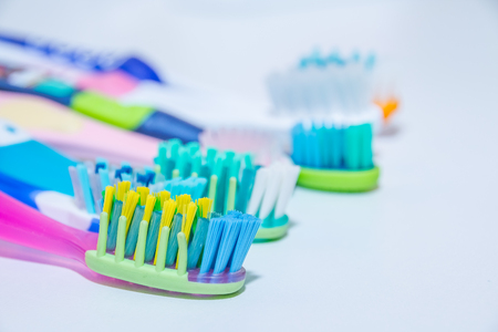 whitening. tooth care. teeth healthy concept. New ultra soft toothbrushes in a row, Dental Industry. various types of toothbrushes. beautiful smile concept.の写真素材