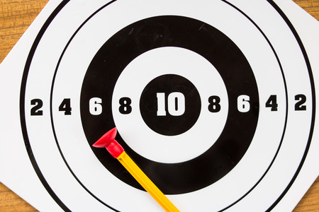 Playing toy darts. Kids game.The concept of setting targets and trying to reach them. Closeup.success ,winner and loser concept, selective focusの写真素材