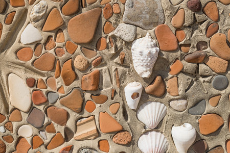 Concept of ancient culture Close up photo of broken colored stones and seashell with mosaic...
