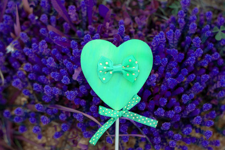 The concept of Love in neon light: Heart on dark blue violet background. Brightness; Light and...