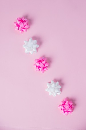 Pink ribbon bow on white backgroundの写真素材