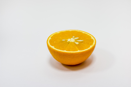 Orange half. Fruit isolated on white background.Breakfast. Juicy orange cut in half to make orange juice for Breakfast. copy space. Health and beautyの写真素材