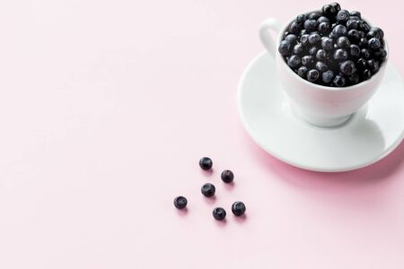 Ripe blueberries in Cup. beautiful summer harvest season concept. Fresh blueberries. ceramic Cup filled with blueberries. Selective focus. Healthy and tasty snack, organic food.Copy spaceの写真素材