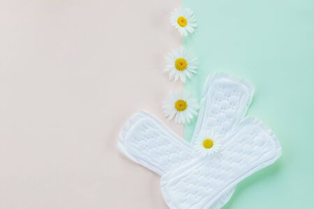 Menstruation sanitary soft pad, hygiene protection. gynecological menstruation cycle. daisy flower, chamomile and menstruation pad,sanitary napkin for every day.daily panty liners.Copy spaceの写真素材