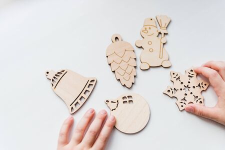 Wooden Christmas tree ornaments on white background.の写真素材
