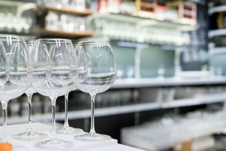 Shelves of modern stemware glasses for sale in storeの写真素材