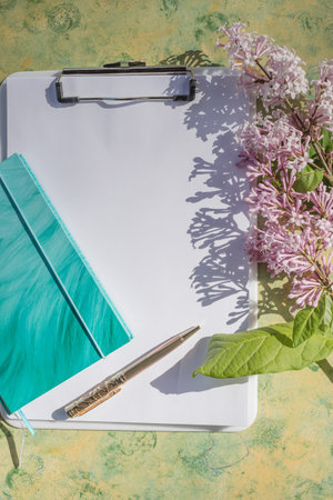 notebook mockup with lilac flowers, new goal. new year plan. fresh start, with goal...