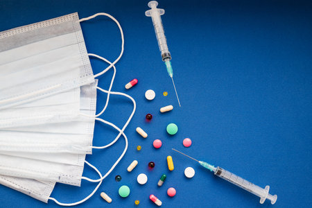 Coronavirus . the new coronavirus 2019-nCoV , pills and white medical mask. Concept of coronavirus...