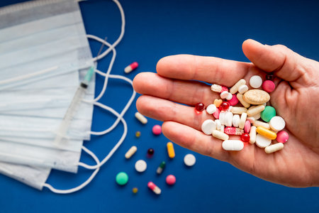 COVID-19, Coronavirus flu dose of medicine or treatment drug concept, colorful pill tablet from...