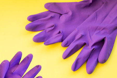 a pair of household rubber gloves isolated on a white background