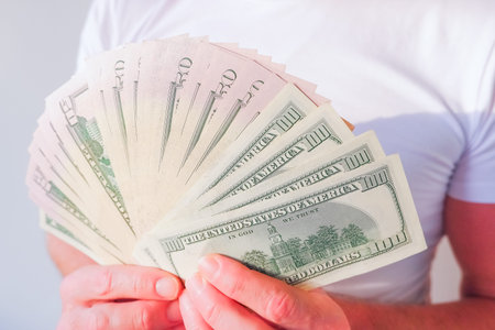 man enjoying the money, Hand receiving money, US dollars, Rich with success.Transfer of money from...