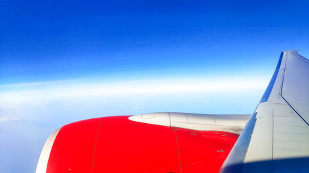 View through the window of an airplane during a flight over clouds during the day.Coronavirus...