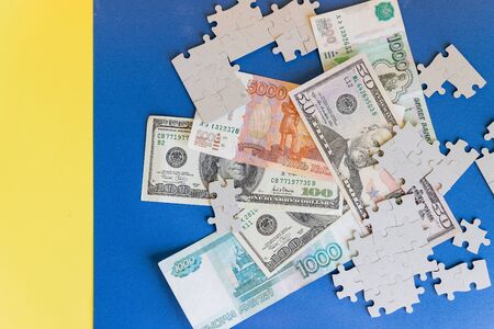 Missing jigsaw puzzle pieces on money dollar background, Business solution concept ,key for successの写真素材