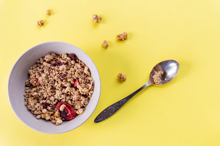 delicious and healthy wholegrain muesli breakfast, with lots of dry fruits, nuts, grains and a fresh...