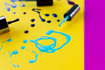 Pouring paint colors on bright background.nail polish enamel sample.abstract design. Nail Polish Splashes. art set.Artistic blend of different shades of pink and crimson nail polish in fused blobsの写真素材