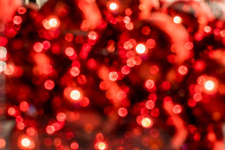 Abstract defocused blurred background. Festive background.red and white bokeh , christmas and happy new year banner. ad or postcardの写真素材