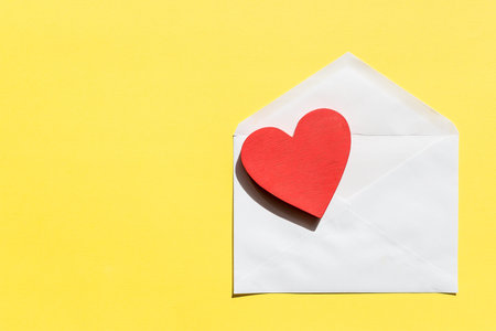 Opened envelope and red heart.Creative design for packaging, blogger.Happy birthday, wedding,...