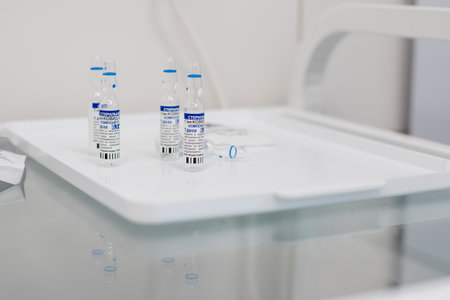 Omsk, Russia, February 9,2021.Sputnik vaccine. vaccine ampules known as Sputnik V.Ampules with russian letters translated as Gam-COVID-Vac, Component.first component of Russian coronavirus vaccineのeditorial素材