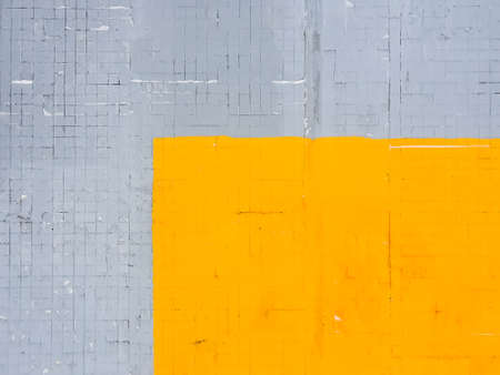 Colored duotone brick wall with trendy colors of 2021 - Ultimate gray and Illuminating yellow.Grunge, old, Abstract bright background.Duotone colored concrete wallの写真素材