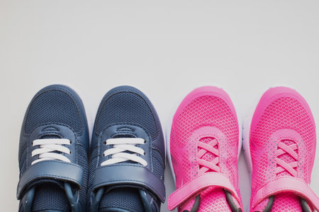 Fashion stylish textile kids shoe. teens footwear with laces empty space for text.Fashion stylish sport shoes for walking, running, training.childrens sports sneakersの写真素材