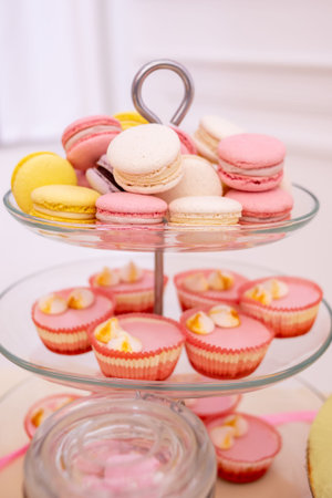 French macaroons on a cake stand .Candy bar with macaron, cakes, cheesecakes, cake pops.Colorful...