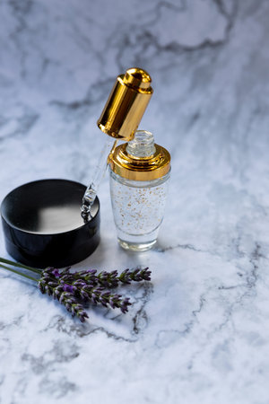 Eco Mineral oil with pipette dropper. Transparent hyaluronic serum gel and skin care concept. Cosmetic pipette and bottle of cosmetic product,hyaluronic acid.cosmetic with peptide and collagenの写真素材