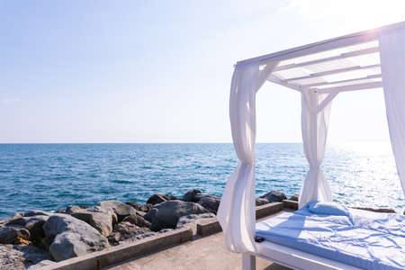 pavilion on beach with sea background in cloudy day - travel and vacation concept.Luxury beach tents canopies.Romantic gazebo.canopies with white curtains. bungalow is near the sea.Copy spaceの写真素材
