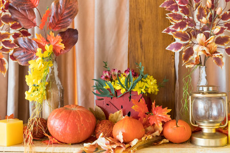 Autumn composition. Pumpkins, candles and dried flowers. Autumn holidays, fall,...