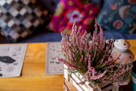 Pink heather in wooden box, gift box with lace bow, candles, vintage style.Autumn decoration.home decor idea. Set of cozy seasonal decorations.Blooming heatherの写真素材
