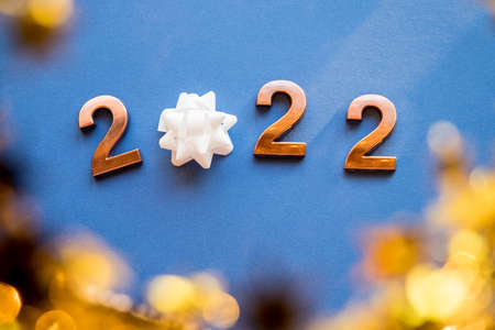 gold Numbers 2022, new year holiday. Celebration concept. blue background.Happy new year, poster, banner, or greeting card.の写真素材