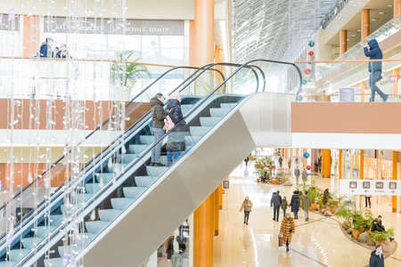 moscow,russia -January 27, 2022: People Shopping in mall, wearing protective or medical face masks due to Covid-19 coronavirus.Shopping in the coronavirus pandemic.People, sale, black friday concept.のeditorial素材