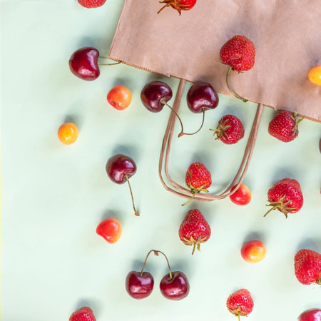 Organic fruits and vegetables with paper bag. view from above on a paper bag with fresh berries....