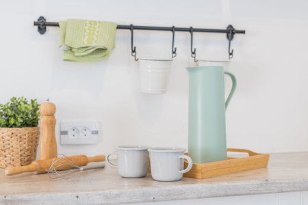 Modern kitchen with shelves, food, spice and dishes.kitchen corner with various cooking utensils including plants,wooden utensils ,glass container.loft interior of kitchen in apartment.の写真素材