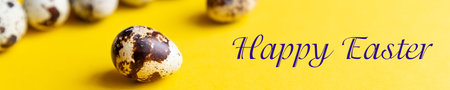 Minimal easter concept. qual spotted Easter eggs row on yellow background. Easter card with copy...