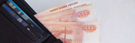 money in leather wallet.. The concept of business, bill payment, financial savings money, exchange rate.russian money in leather wallet,credit gold gard.Vip bank service.の写真素材