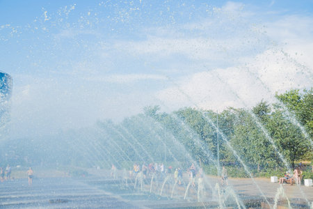 Clean water running from many taps with sparkling drops.Splash of water in the fountain.Water arches...