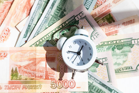 2022 money, economy and investment plan. new year economy crisis and change. money, alarm clock ,finance background.Bankruptcy and debt. Pay for debt. Bank collector service.の写真素材