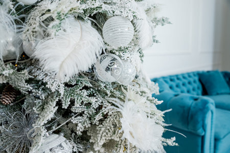 Christmas interior,Christmas tree with silver and white balls, decorations and lights. Fancy house. Christmas and happy New year concept. Postcardの写真素材