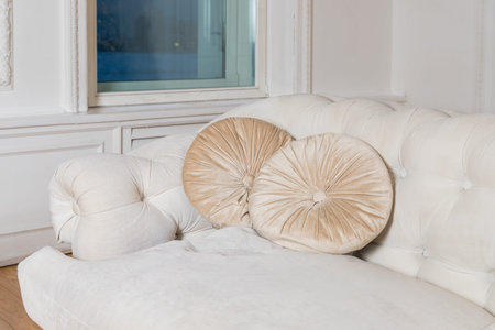 Luxury and classic style pillows on beige sofa. decorative beige suede cushions on couch.
