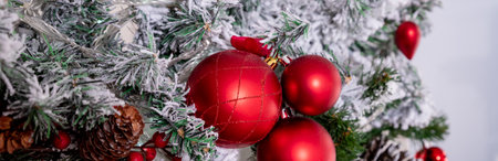 Christmas decoration on living room interior background.Red christmas ornaments on christmas tree. Merry christmas card. Winter holiday theme. Happy New Year.の写真素材