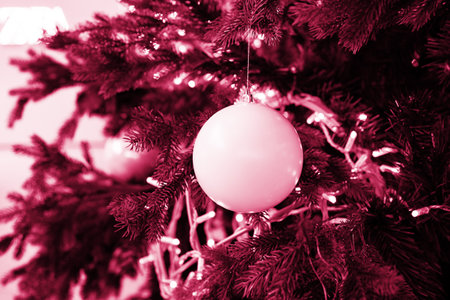 Christmas composition. Lots of silver Christmas tree decorations, top view. Color Viva Magenta. Demonstrating the colors of 2023.の写真素材