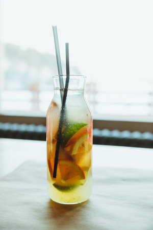 Refreshment Summer drink. Traditional lemonade with lemon mint and ice on table.Soft drinks, healthy beverage.の写真素材