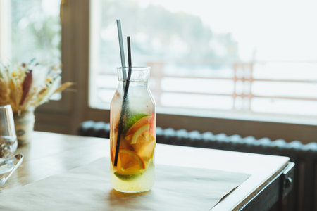 Refreshment Summer drink. Traditional lemonade with lemon mint and ice on table.Soft drinks, healthy beverage.の写真素材