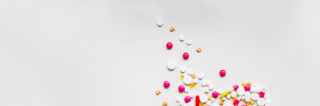 Frame of colorful antibiotic capsule pills. Antibiotic drug resistance concept. Pharmaceutical...