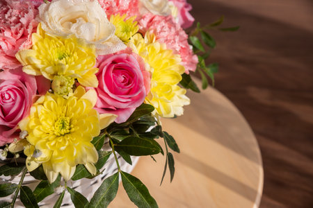 Background of beautiful bouquet of roses and chrysanthemums flowers. Backdrop for holiday, birthday,の写真素材